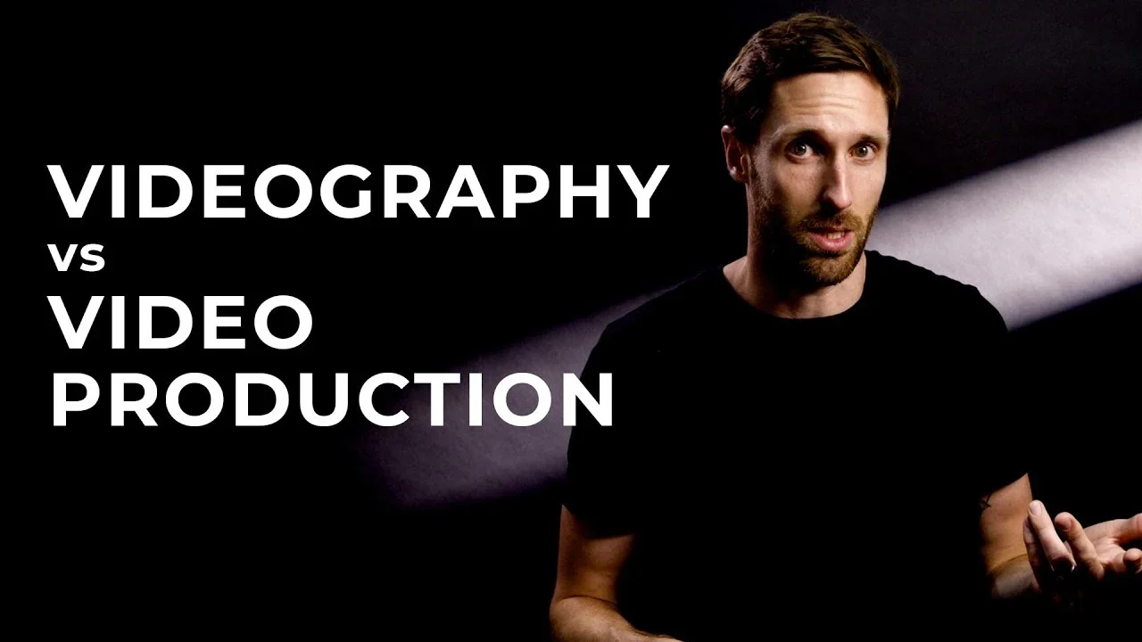 A man discussing the difference between videography and video production, representing the contrast between filming single events and full-scale video production projects.