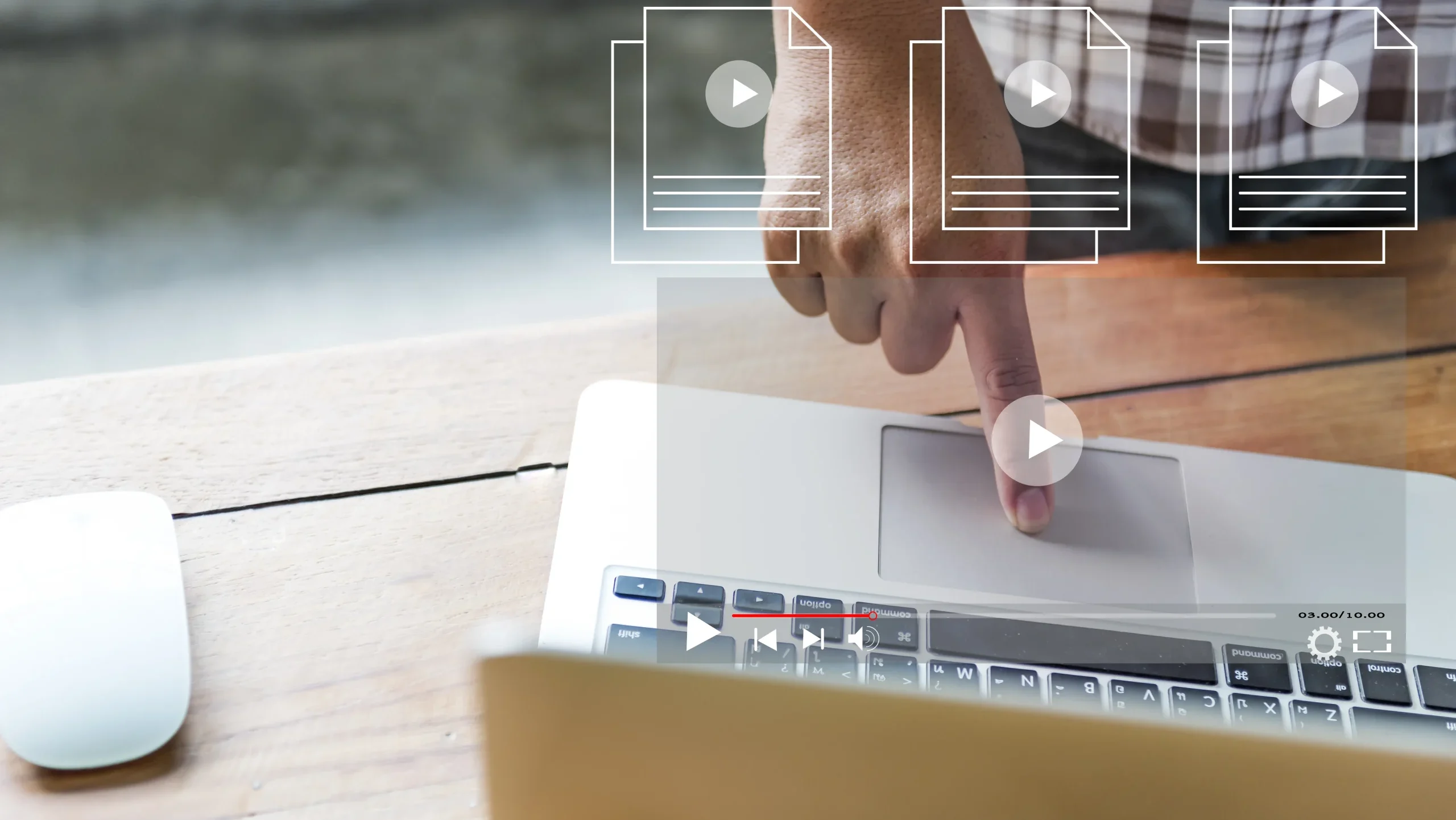 Person pressing laptop touchpad to play online video, representing video content creation and digital marketing strategy.