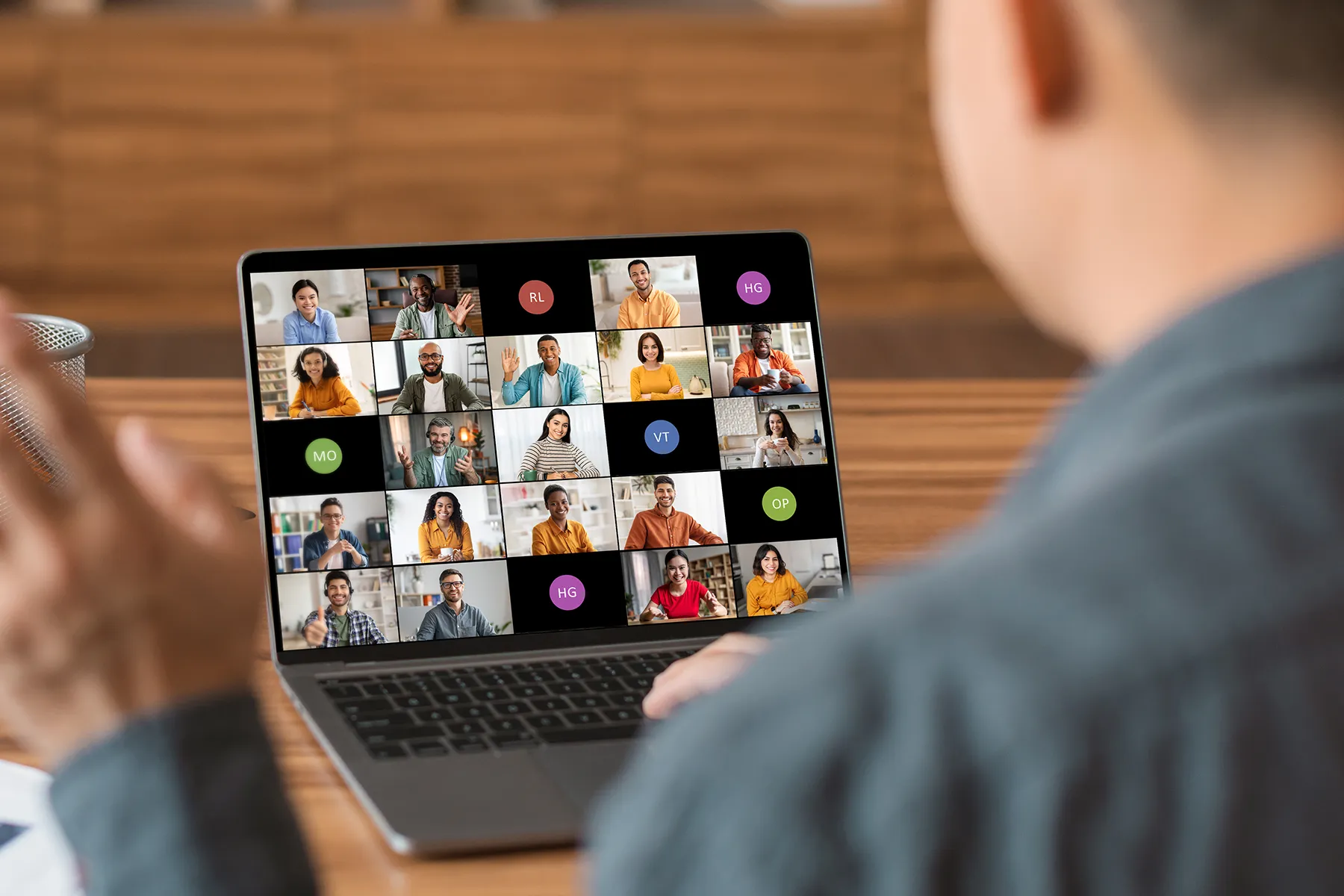 Online video meeting displayed on laptop screen with multiple participants