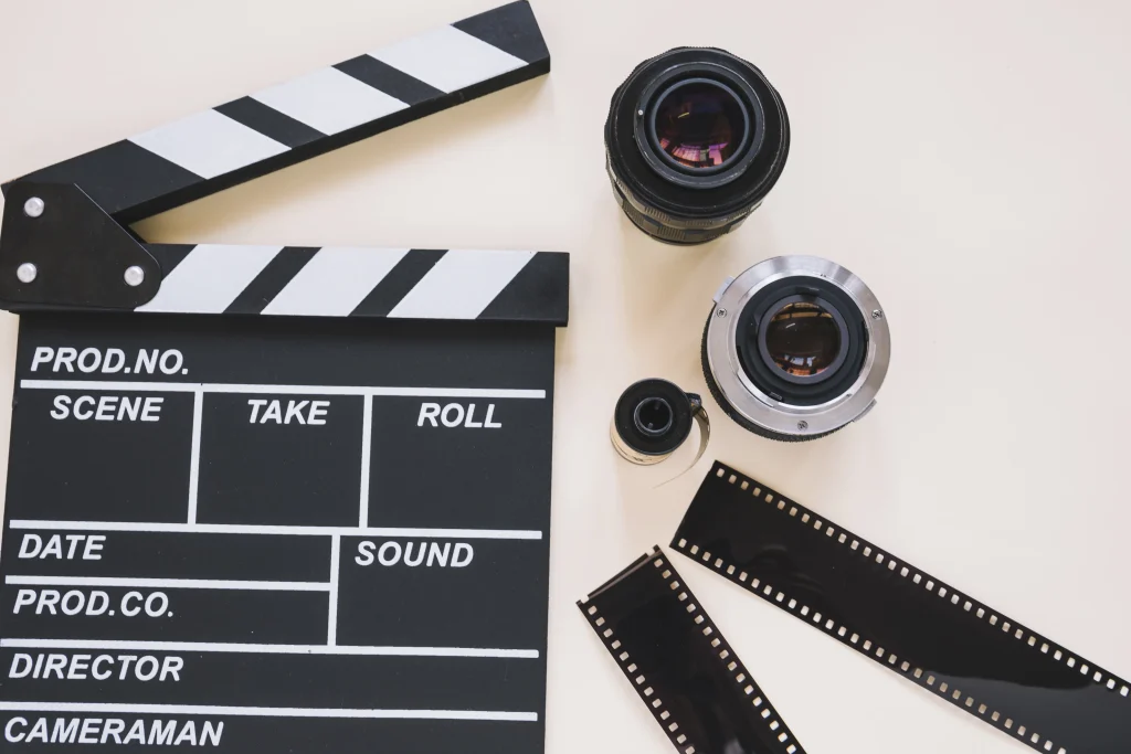 Video production tools including camera lens and clapperboard